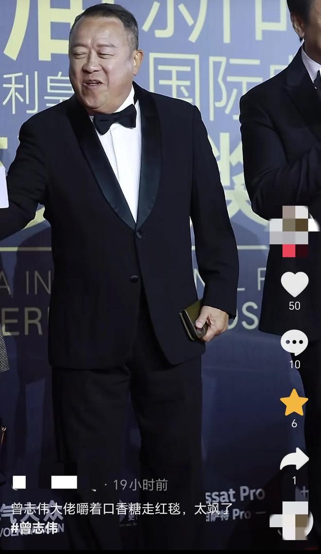 嚼口香糖与金沙总裁骑旋转木马挺幼稚m6米乐曾志伟澳门参加电影节台上(图5)